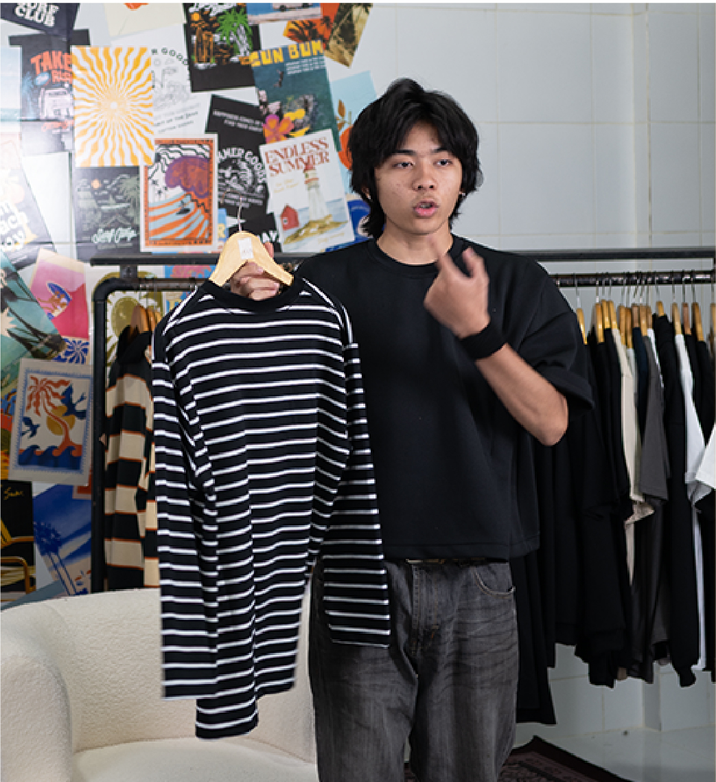 Holding shirt pointing self